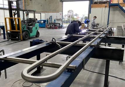 Mechcon performing welding on hand rails for a school.