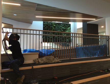 man installing stainless steel handrails, stainless steel balustrades, stainless handrails Melbourne