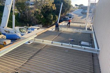 First sages of a packing factory roof plant platform being installed.